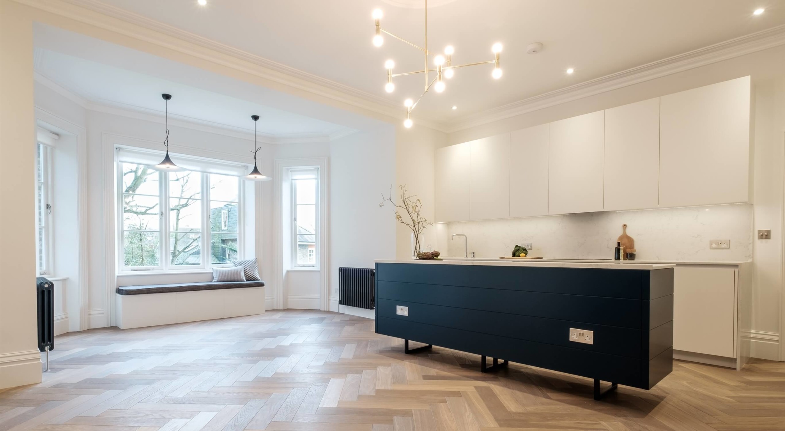 Apartment in Hampstead- bespoke kitchen island in royal blue wiht sockets